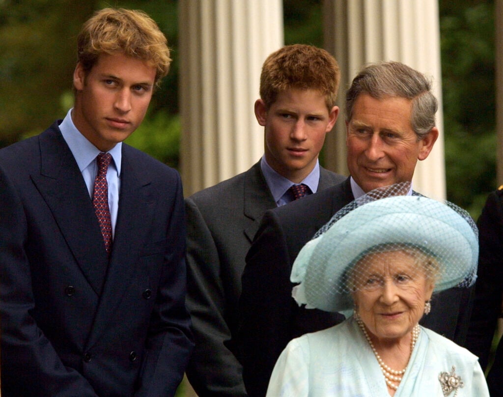 A young Prince William, Prince Harry, a not so young Prince Charles, and the late Queen Mother in 2001.