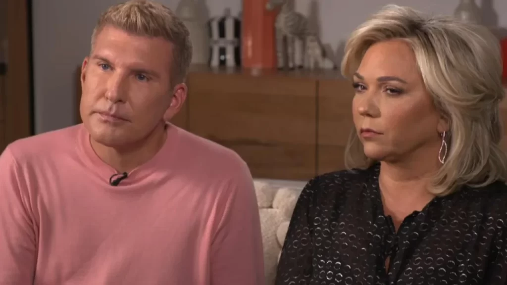 Todd Chrisley and Julie Chrisley sit side-by-side.